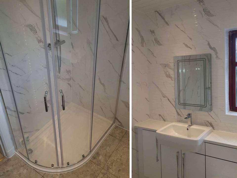 fitted bathroom with carrara marble effect tiles and made to measure vanity units Gallery Image