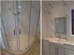 fitted bathroom with carrara marble effect tiles and made to measure vanity units Gallery Thumbnail