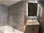 fitted bathroom with waterfall tiles and led mirror Gallery Thumbnail
