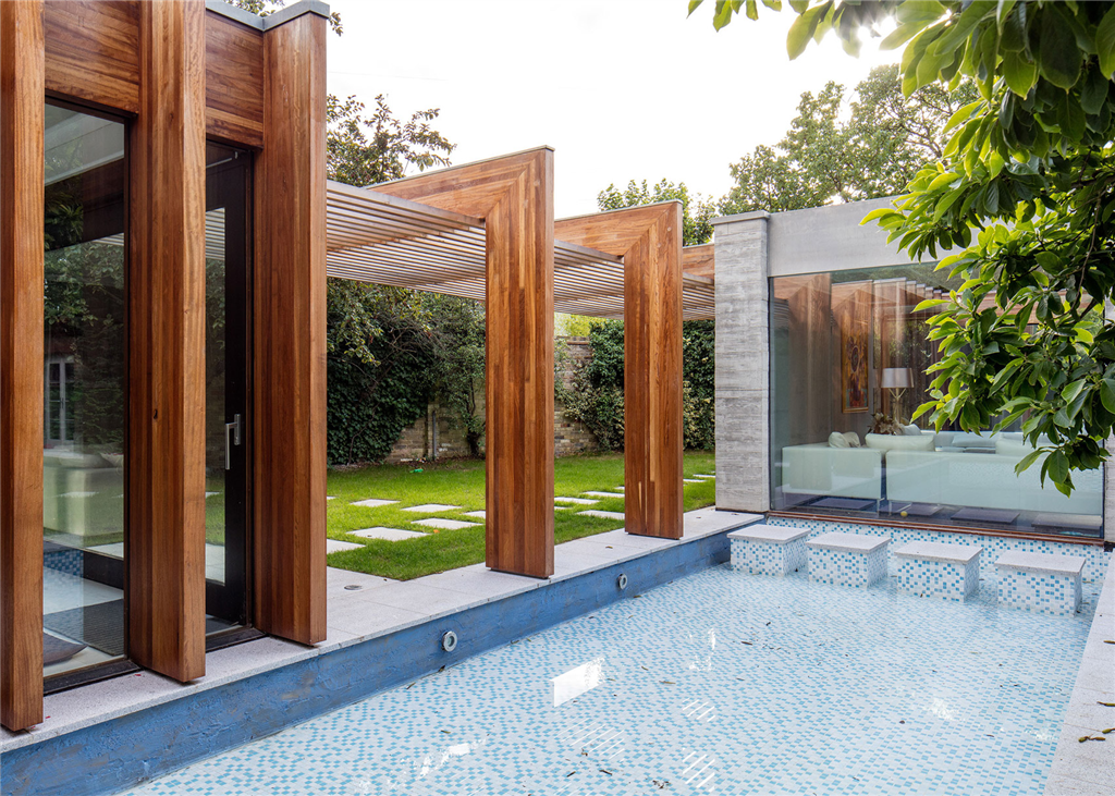 Iroko glulam beams, manufactured for London project. Gallery Image
