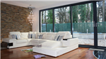 Bifolding doors, feature wall and sofas in open plan living space Gallery Thumbnail