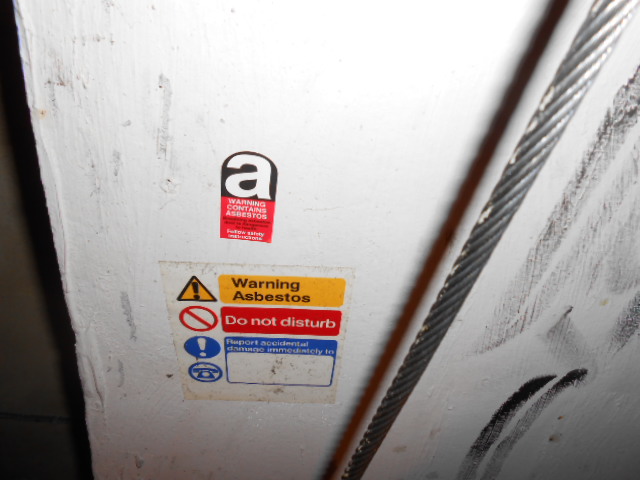 Asbestos insulating board in a lift shaft Gallery Image