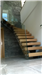 Staircase with metal spine & plate glass balustrade. Gallery Thumbnail