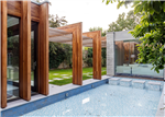 Iroko glulam beams, manufactured for London project. Gallery Thumbnail