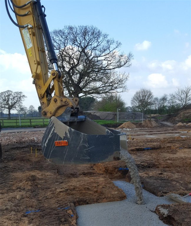 Concrete bucket in action Gallery Image