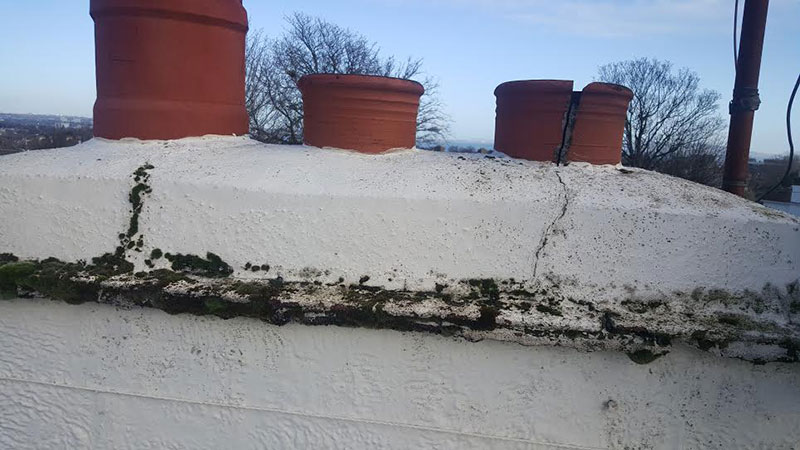 Cracked, unsightly chimney leaking into walls below... Gallery Image
