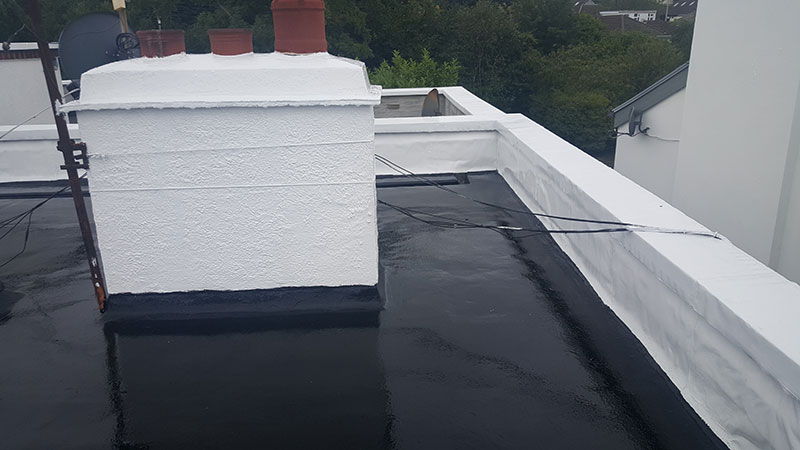 Chimney & pots repaired, painted and sealed with two coats of FlexiStop Clear. Gallery Image
