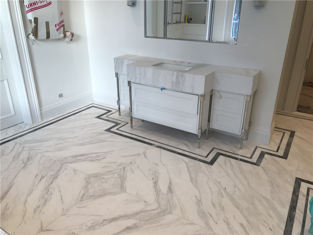 Ariston bookmatched marble floor with Bardilio marble borders, London. Gallery Image