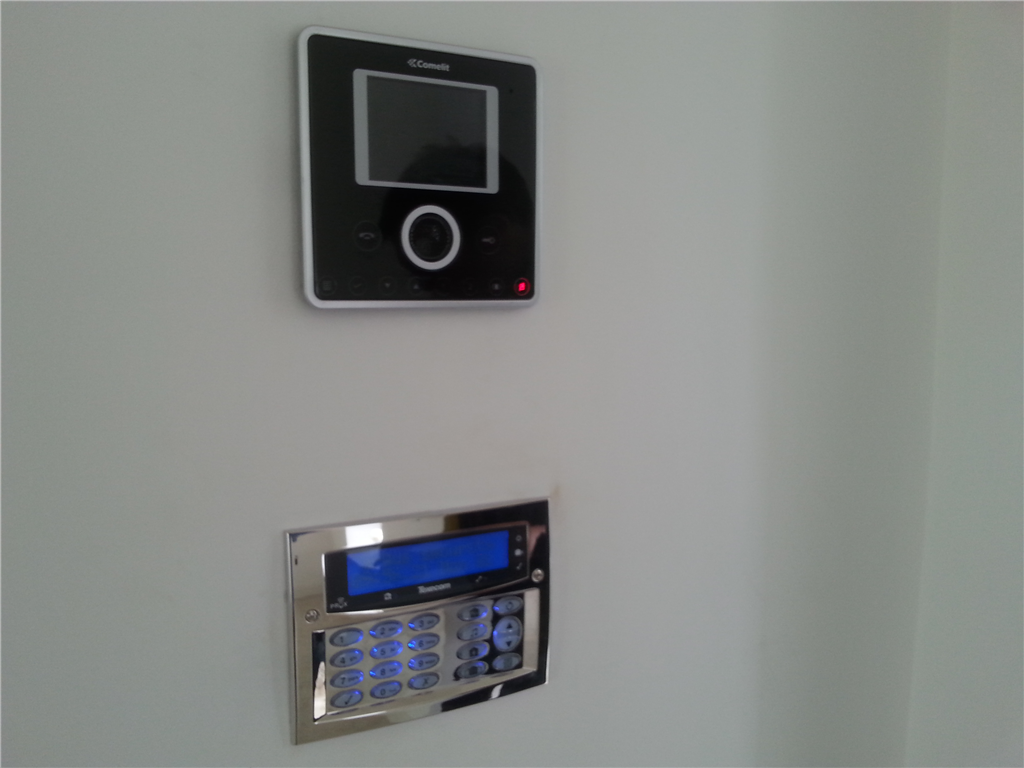 Texecom Chrome effect flush alarm keypad and Comelit Video intercom station installed in a domestic property in Lancashire in 2016. Gallery Image