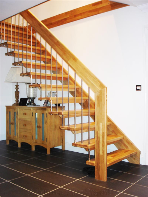 Bespoke Beech straight flight, open treads with supported steel spindles and handrail Gallery Image