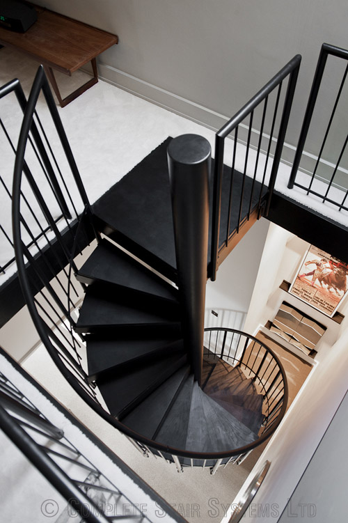 Bespoke Spiral Stair with timber cover painted treads and vertical steel powder coated balustrade  Gallery Image