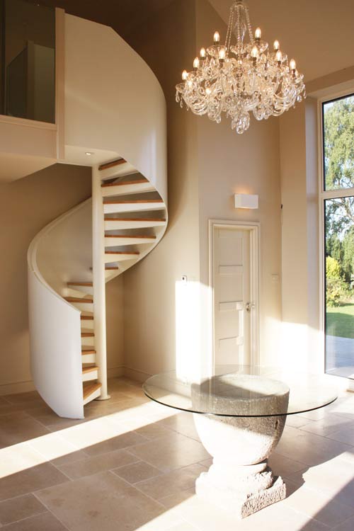 Bespoke Spiral Stair,
perforated steel treads, topped with 30mm timber and steel powder coated balustrade. Gallery Image