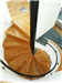 Bespoke Spiral Stair, enclosed balustrade, with boxed oak treads and powder coated steel handrail. Gallery Thumbnail